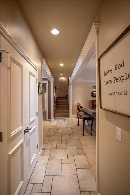 hallway with stairs and recessed lighting