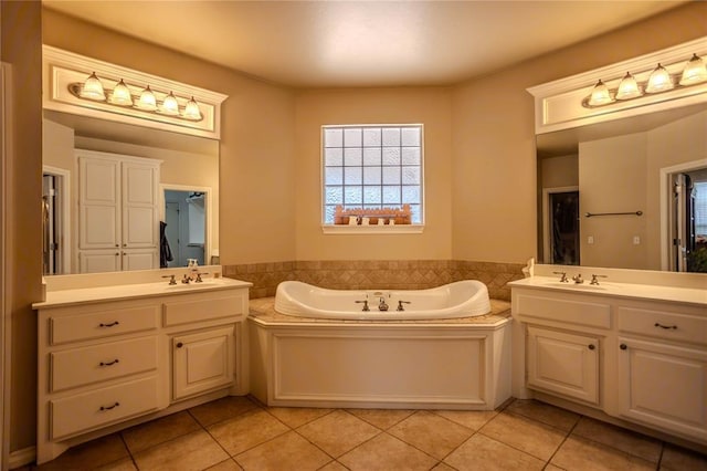 full bathroom with two vanities, tile patterned floors, and a sink