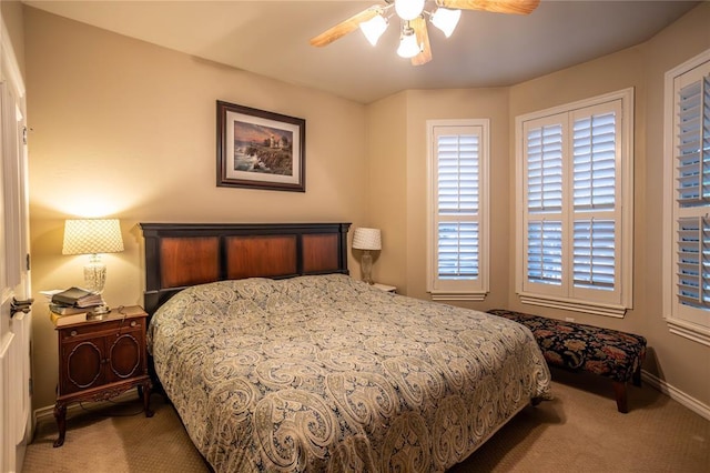 bedroom featuring a ceiling fan, baseboards, and carpet floors