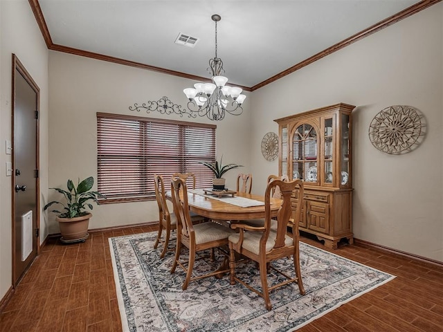 dining area with crown molding, a chandelier, dark wood finished floors, and visible vents