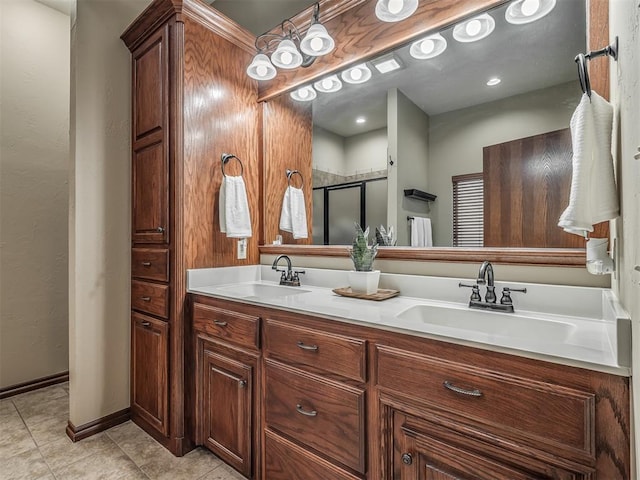full bath with double vanity, a sink, tile patterned floors, and a shower stall