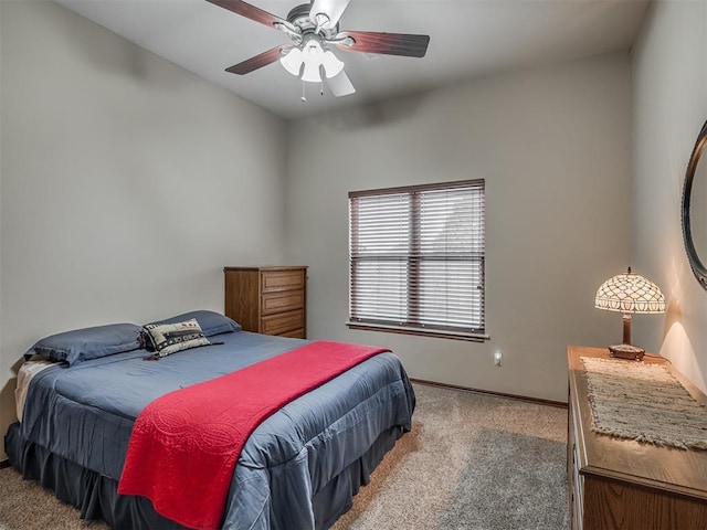 carpeted bedroom with baseboards and ceiling fan