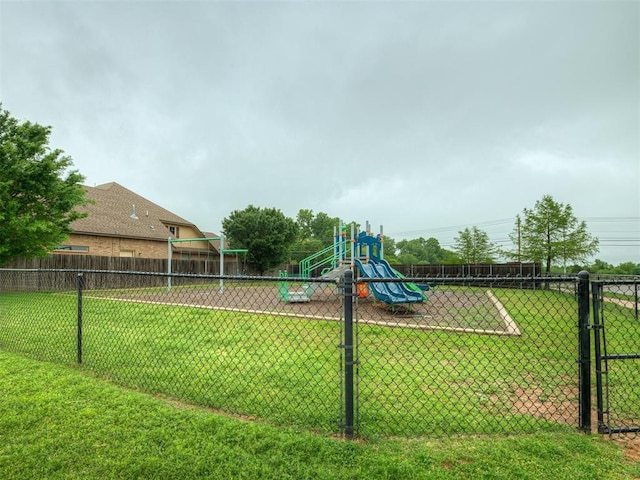 view of yard with fence and playground community