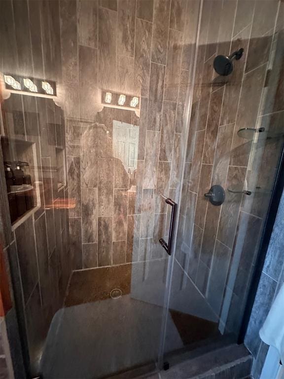 full bath featuring a shower stall
