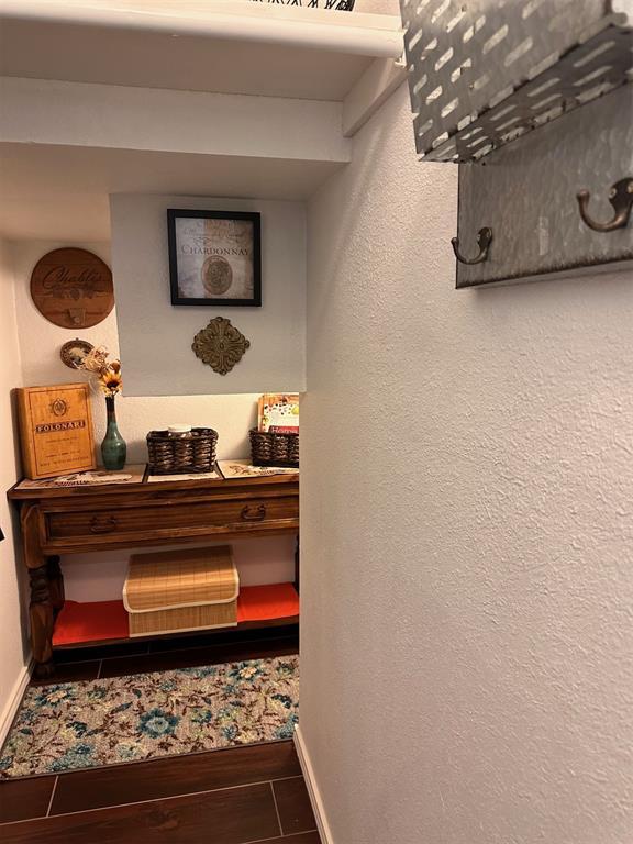 interior details with baseboards and wood finished floors