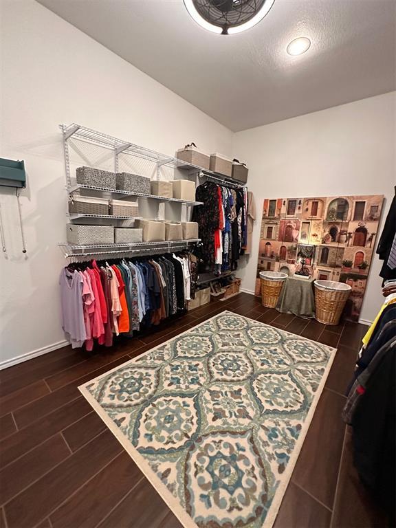 spacious closet featuring wood finished floors