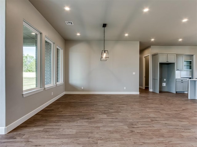 15528 NE 36th St, Choctaw, OK 73020 - unfurnished dining area with recessed lighting, light wood-style floors, visible vents, and baseboards