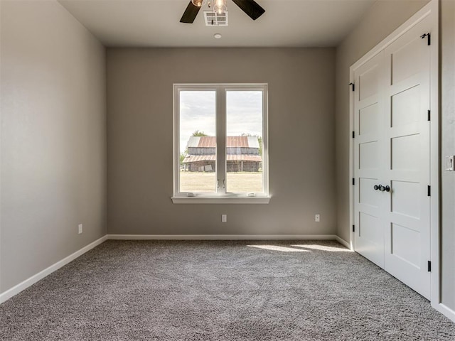 15528 NE 36th St, Choctaw, OK 73020 - unfurnished bedroom featuring visible vents, carpet flooring, baseboards, and a ceiling fan