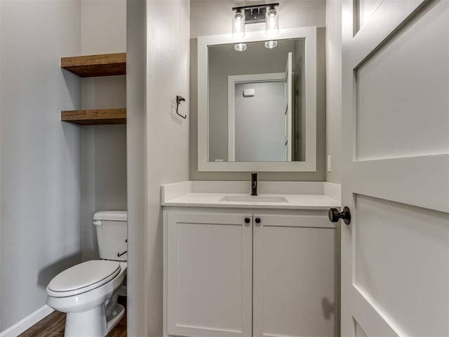 15528 NE 36th St, Choctaw, OK 73020 - half bath with baseboards, wood finished floors, vanity, and toilet