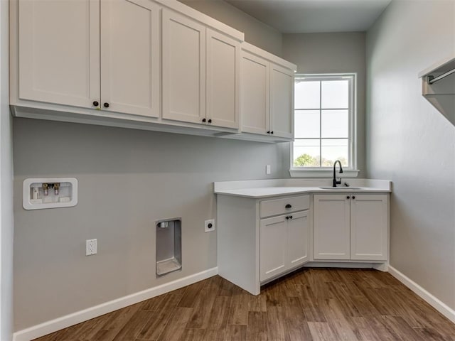15528 NE 36th St, Choctaw, OK 73020 - laundry area with dark wood-style floors, a sink, baseboards, washer hookup, and cabinet space