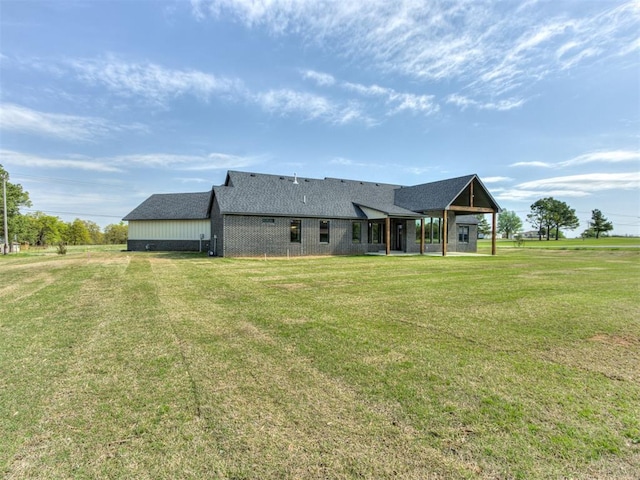 15528 NE 36th St, Choctaw, OK 73020 - back of house with a lawn and a shingled roof