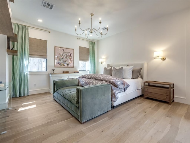 2320 Belleview Dr, Oklahoma City, OK 73112 - bedroom featuring a notable chandelier, baseboards, recessed lighting, light wood-style flooring, and visible vents