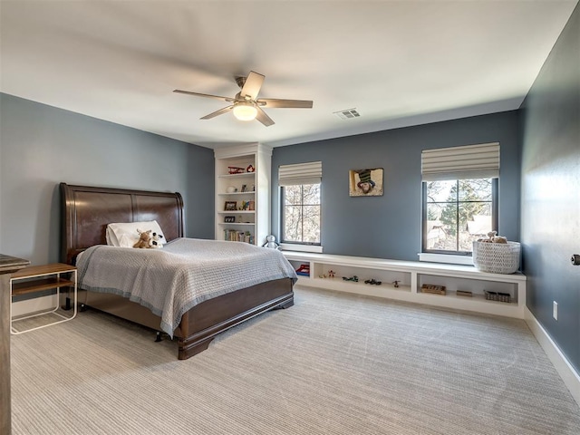 2320 Belleview Dr, Oklahoma City, OK 73112 - bedroom featuring multiple windows, a ceiling fan, visible vents, and carpet floors