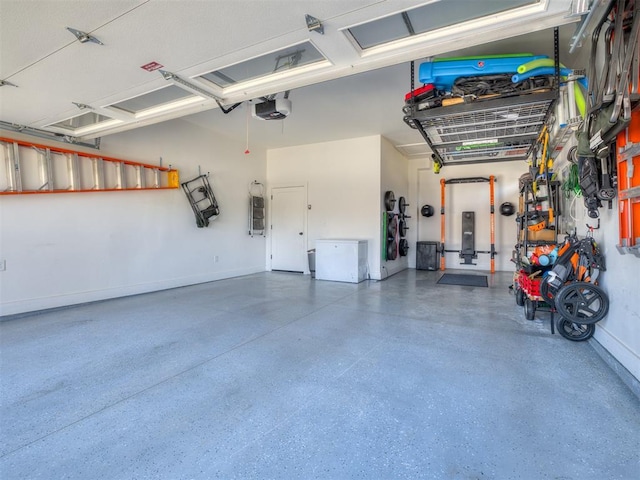 2320 Belleview Dr, Oklahoma City, OK 73112 - garage with baseboards and a garage door opener