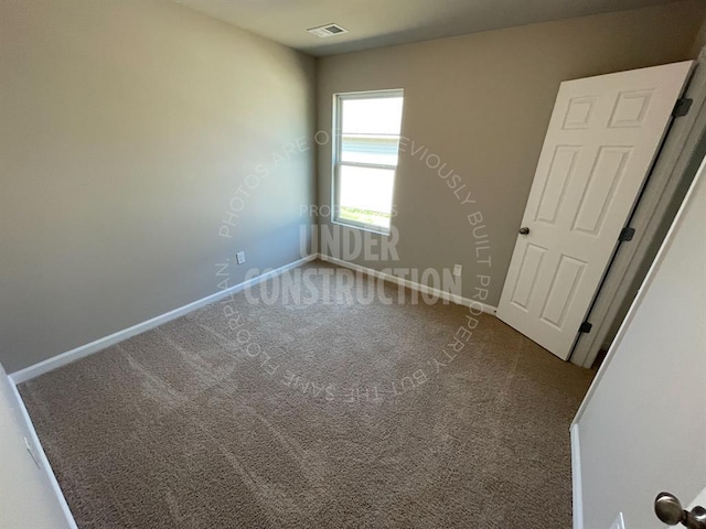 unfurnished bedroom with baseboards, visible vents, and carpet floors