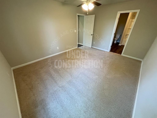 unfurnished bedroom featuring baseboards, carpet flooring, ceiling fan, and connected bathroom