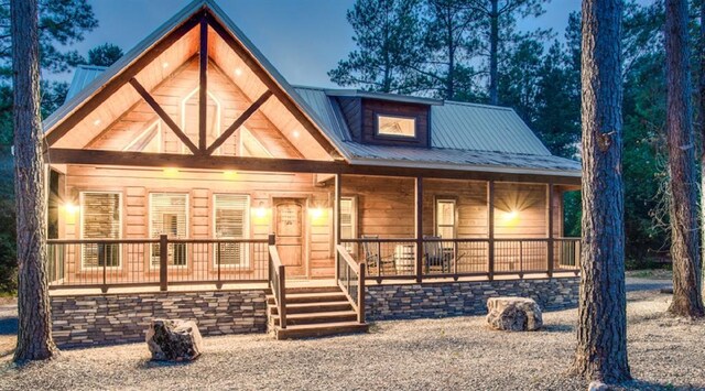 view of front of house with a porch and metal roof