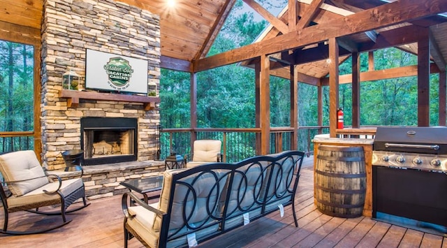 sunroom / solarium featuring a fireplace