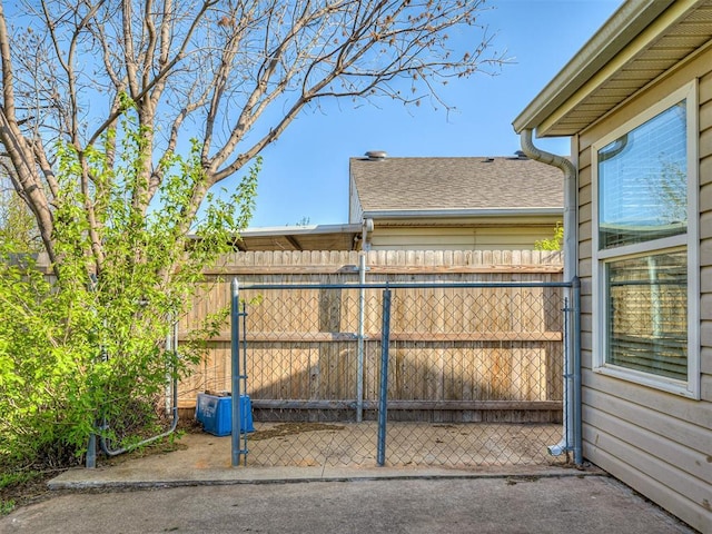 14813 Moon Daisy Dr, Edmond, OK 73013 - view of gate featuring fence