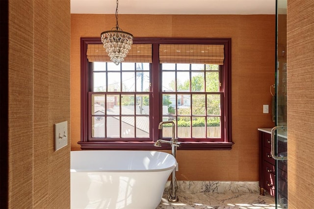 812 NW 38th St, Oklahoma City, OK 73118 - full bathroom with a chandelier, a healthy amount of sunlight, and a freestanding bath