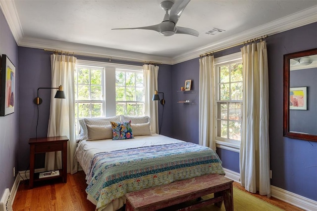 812 NW 38th St, Oklahoma City, OK 73118 - bedroom with crown molding, multiple windows, and visible vents