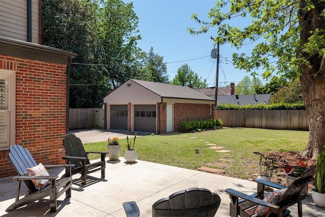 812 NW 38th St, Oklahoma City, OK 73118 - view of patio featuring a fenced backyard, an outbuilding, an outdoor fire pit, and a garage