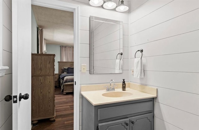 bathroom featuring wood finished floors and vanity