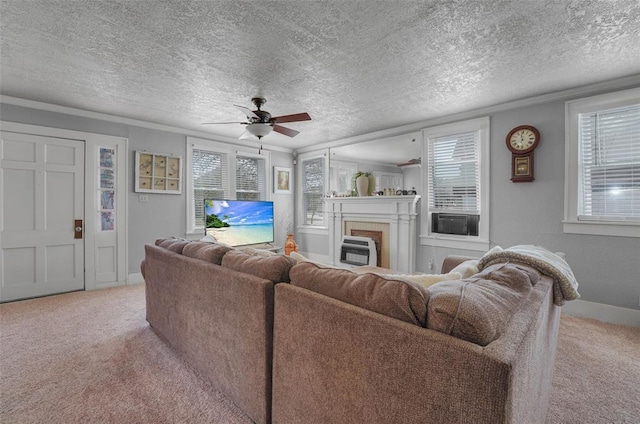121 S Randlett St, Hobart, OK 73651 - living room with a fireplace, a ceiling fan, light carpet, and a textured ceiling