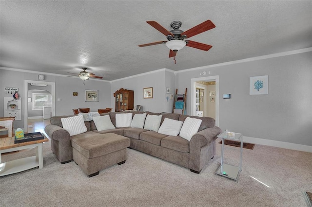 121 S Randlett St, Hobart, OK 73651 - carpeted living area with ornamental molding, baseboards, a ceiling fan, and a textured ceiling