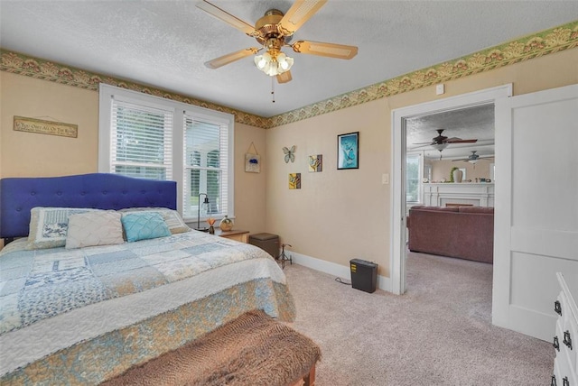 121 S Randlett St, Hobart, OK 73651 - bedroom featuring carpet flooring, a textured ceiling, baseboards, and a ceiling fan