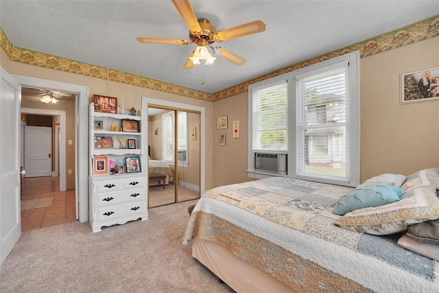 121 S Randlett St, Hobart, OK 73651 - carpeted bedroom featuring cooling unit, a closet, and ceiling fan