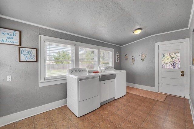 121 S Randlett St, Hobart, OK 73651 - clothes washing area with crown molding, a textured ceiling, a textured wall, baseboards, and cabinet space