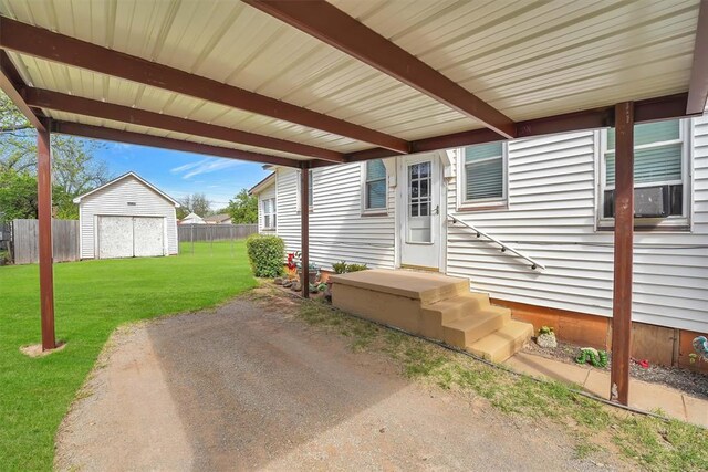 121 S Randlett St, Hobart, OK 73651 - view of patio with a storage unit, fence, and an outdoor structure