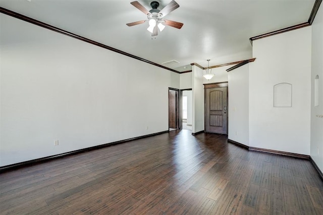 73 Bonaire Dr, Edmond, OK 73013 - spare room with a ceiling fan, ornamental molding, wood finished floors, and baseboards