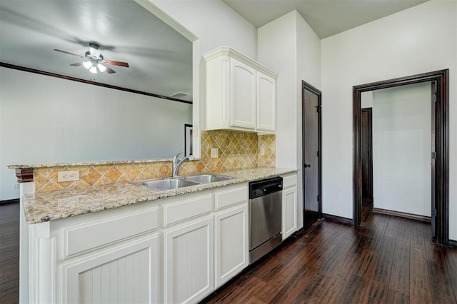 73 Bonaire Dr, Edmond, OK 73013 - kitchen featuring dishwasher, a sink, dark wood-type flooring, decorative backsplash, and a ceiling fan