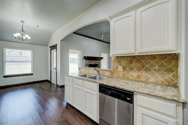 73 Bonaire Dr, Edmond, OK 73013 - kitchen featuring stainless steel dishwasher, a sink, decorative backsplash, dark wood finished floors, and light stone counters