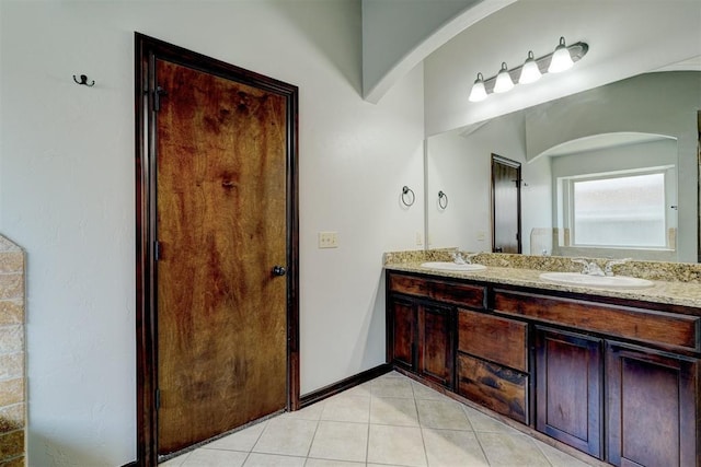 73 Bonaire Dr, Edmond, OK 73013 - full bath featuring double vanity, tile patterned floors, and baseboards