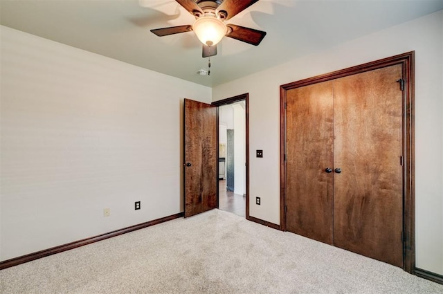 73 Bonaire Dr, Edmond, OK 73013 - unfurnished bedroom featuring baseboards, carpet flooring, a closet, and a ceiling fan