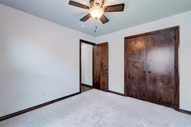 73 Bonaire Dr, Edmond, OK 73013 - carpeted bedroom with baseboards, a closet, and ceiling fan