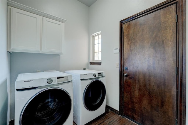 73 Bonaire Dr, Edmond, OK 73013 - laundry area with washing machine and dryer, cabinet space, dark wood-style flooring, and baseboards