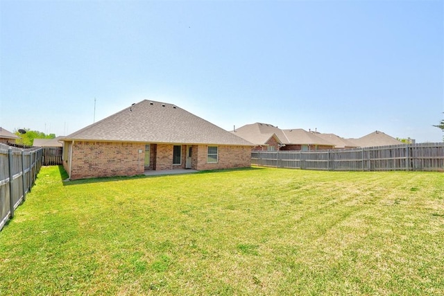73 Bonaire Dr, Edmond, OK 73013 - rear view of property featuring brick siding and a shingled roof
