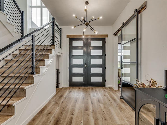 1330 Acclivis Ct, Newcastle, OK 73065 - foyer featuring stairs, french doors, an inviting chandelier, and wood finished floors