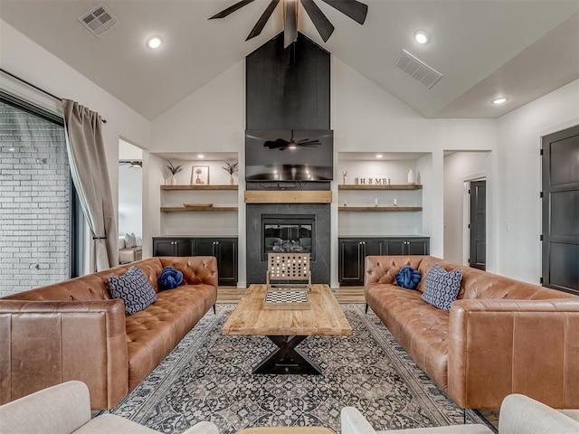 1330 Acclivis Ct, Newcastle, OK 73065 - living area featuring high vaulted ceiling, a fireplace, a ceiling fan, and visible vents
