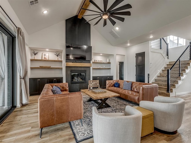 1330 Acclivis Ct, Newcastle, OK 73065 - living room with visible vents, high vaulted ceiling, a ceiling fan, and light wood-style floors