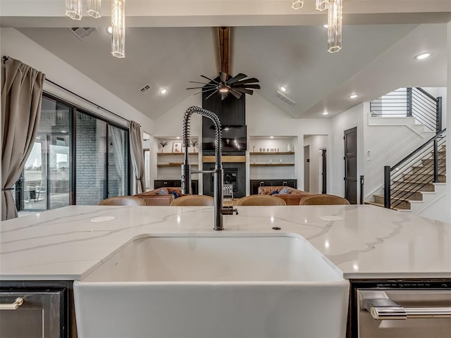 1330 Acclivis Ct, Newcastle, OK 73065 - kitchen with a sink, open floor plan, ceiling fan, light stone countertops, and vaulted ceiling with beams