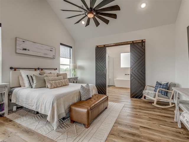1330 Acclivis Ct, Newcastle, OK 73065 - bedroom featuring recessed lighting, high vaulted ceiling, ensuite bath, and wood finished floors
