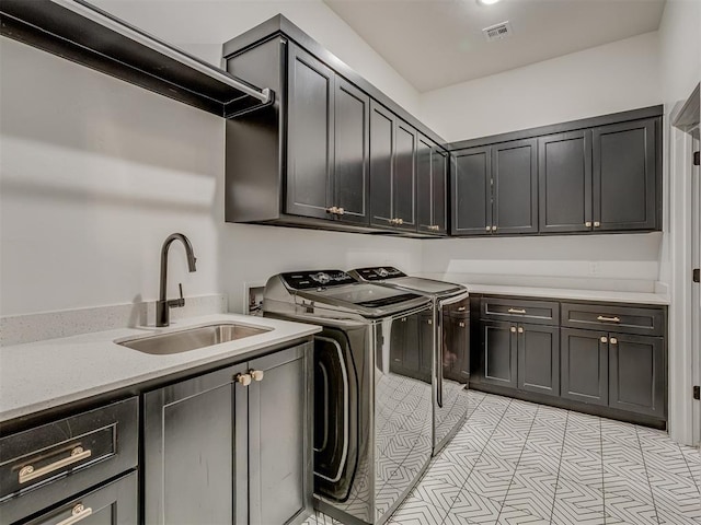 1330 Acclivis Ct, Newcastle, OK 73065 - laundry room with a sink, visible vents, cabinet space, and washer and dryer