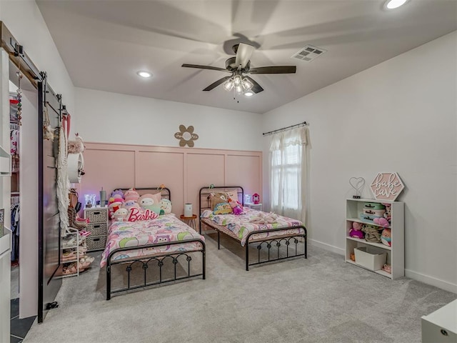 1330 Acclivis Ct, Newcastle, OK 73065 - carpeted bedroom featuring recessed lighting, a barn door, visible vents, and a ceiling fan