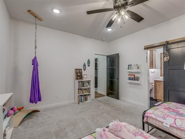 1330 Acclivis Ct, Newcastle, OK 73065 - bedroom with ensuite bath, baseboards, carpet, and a barn door