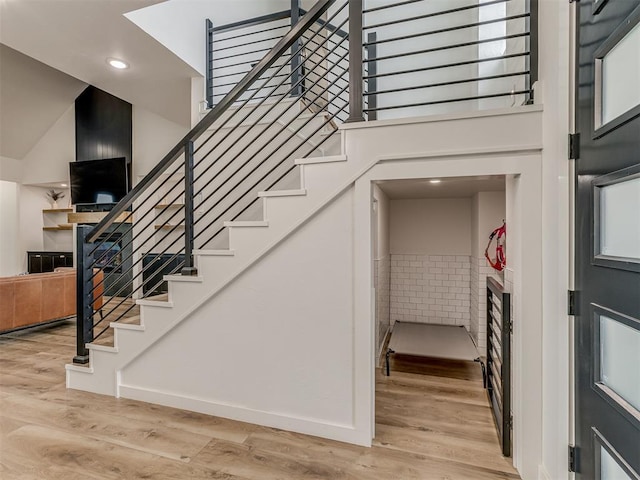 1330 Acclivis Ct, Newcastle, OK 73065 - stairs with a fireplace, recessed lighting, a high ceiling, wood finished floors, and baseboards